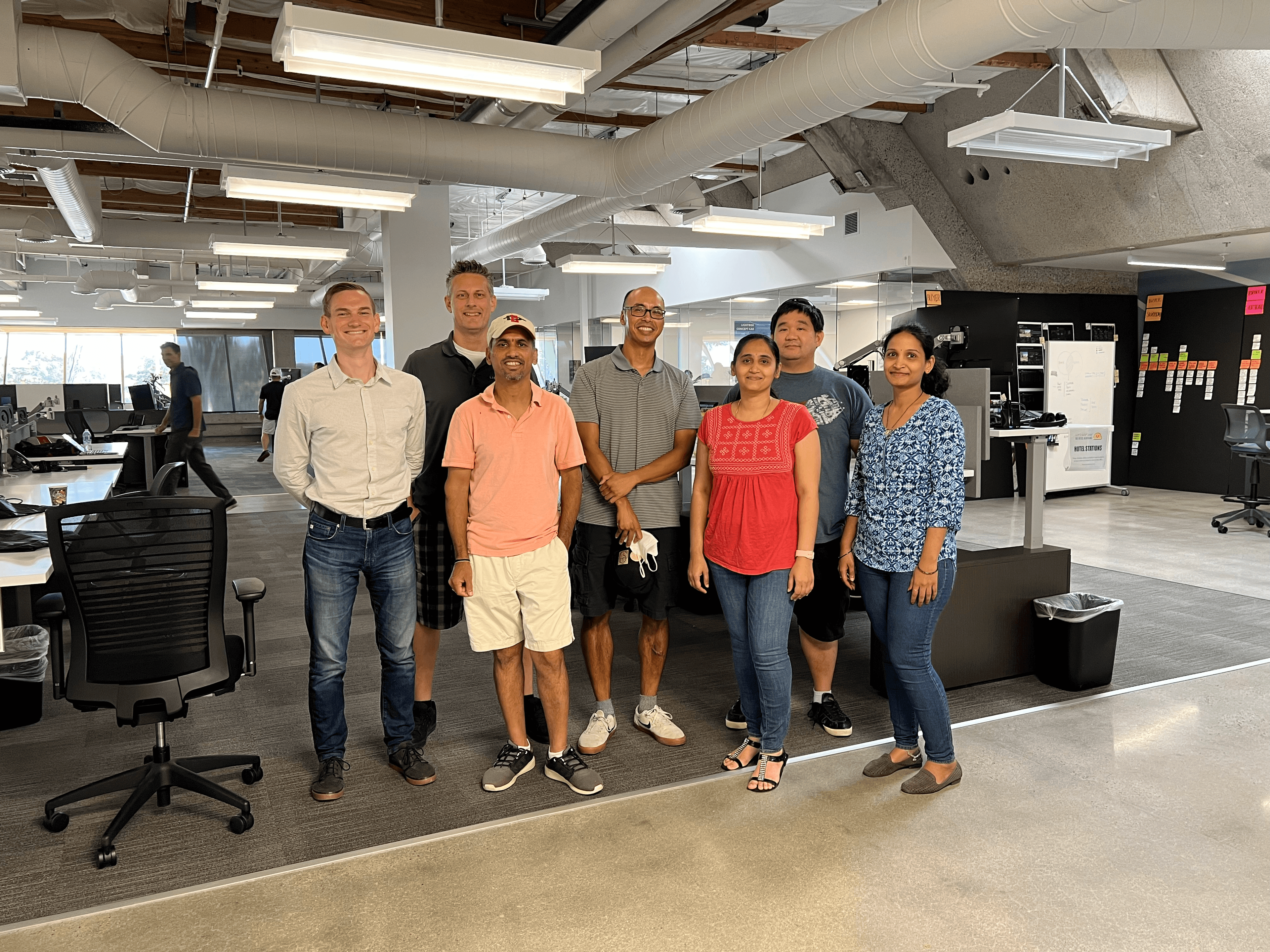 Nate posing with a group of LightBox test engineers at a company event